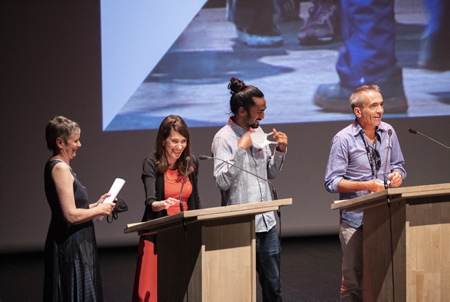 De GàD Féroz Sahoulamide représentant de la troupe de danse dans le documentaire ( INDES GALANTES ),Christine Camdessus AG déléguée générale, Anne Georget Présidente du Festival et le réalisateur de Philippe Béziat INDES GALANTES à Biarritz le 12 juin 2021, lors de l'édition du FIPADOC 2021 et de la soirée d'ouverture du festival à la gare du midi.
From GàD Féroz Sahoulamide representative of the dance troupe in the documentary (INDES GALANTES), Christine Camdessus AG Managing Director, Anne Georget President of the Festival and the director of Philippe Béziat INDES GALANTES in Biarritz on June 12, 2021, during the edition of FIPADOC 2021 and the opening night of the festival at the Gare du Midi.
Biarritz, Pays basque, Nouvelle-Aquitaine, New-Aquitaine, Pyrénées-Atlantiques, Pays Basque, Europe, France.